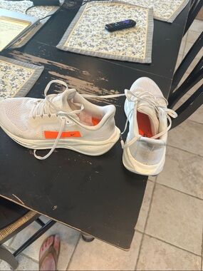 Nike White Running Sneakers with Orange Accents